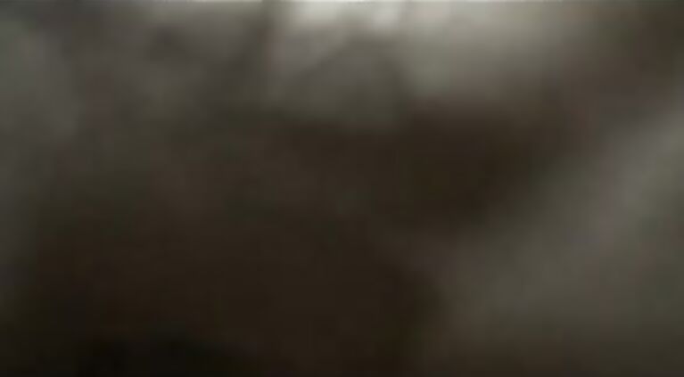 Indian couple on their honeymoon laying naked in bed enjoying passionate seductive french kissing.