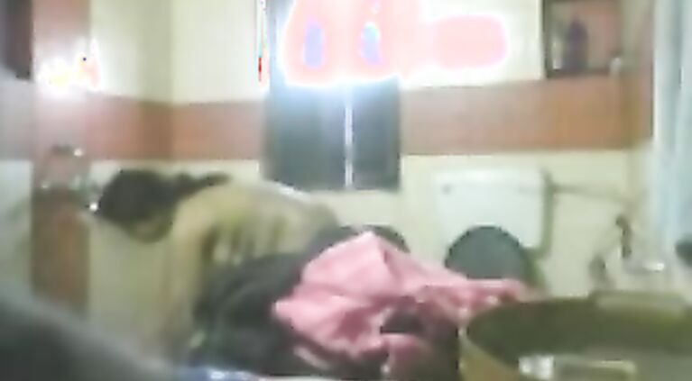 Mature desi bhabhi in bathroom stripping naked unaware of hidden cam being fixed by her dewar to record her naked.