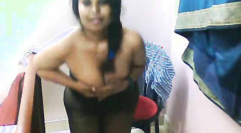 Busty desi babe Lilly in blue shirt and in stockings doing a self recorded strip show leaked online!.