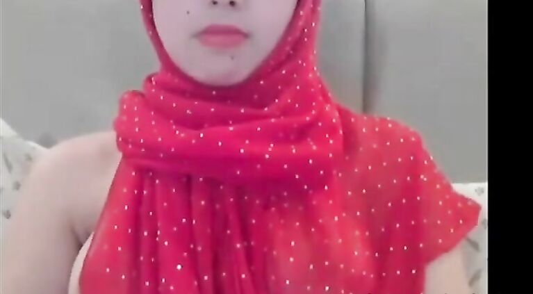 Cute Arab camgirl shows boobs.