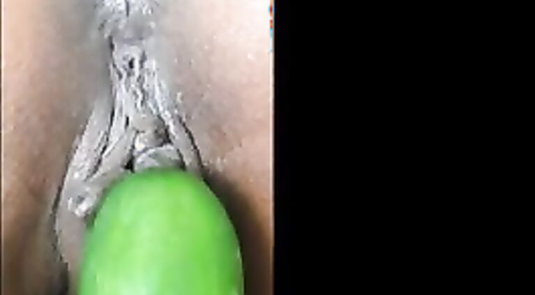 Kinky Indian slut gets fucked with a cucumber.