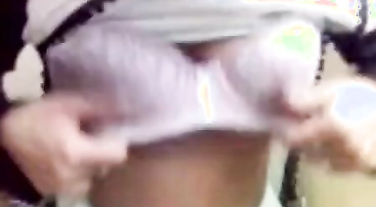 Teen shows tits.