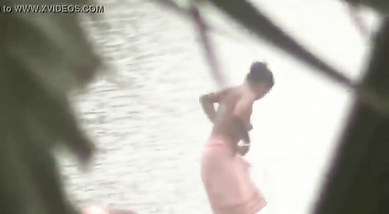 Tamil women bathing by the river