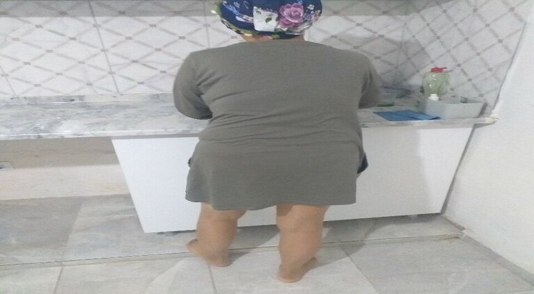 Beautiful peasant woman doing natural kitchen chores